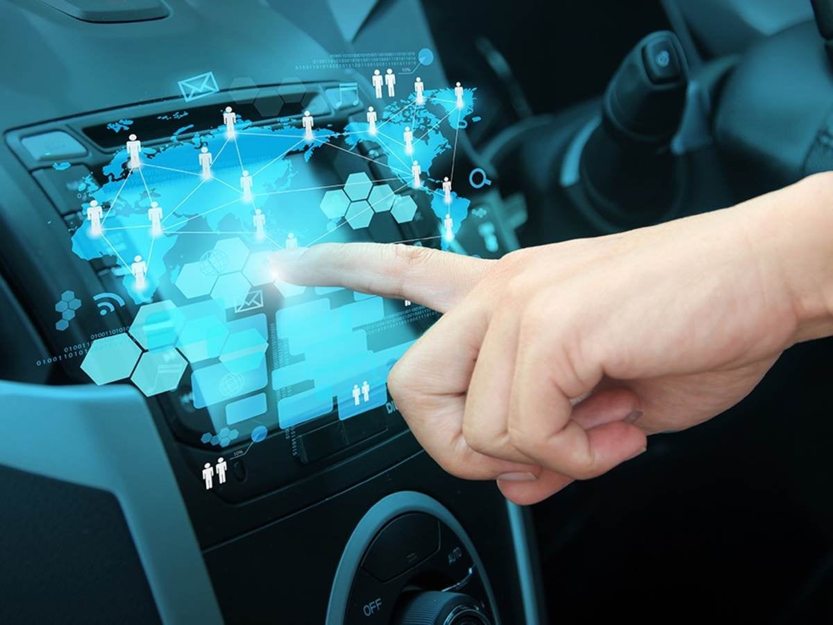 Person touching car UI dashboard